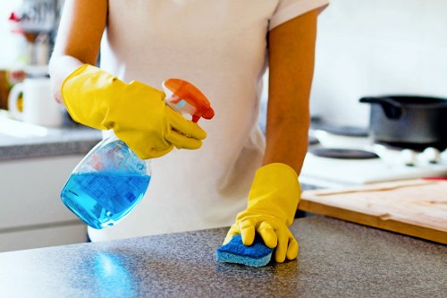 Cleaner Clapham team member using protective gloves and equipment