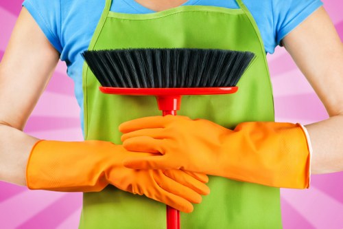 Local cleaners handling a deep clean in a Clapham flat with compact access