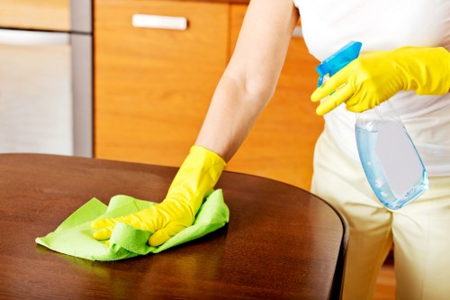 Local carpet cleaning service working in a Clapham property with household furniture nearby